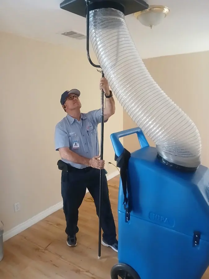 Furnace Tune-Up technician using HEPA equipment in Minneapolis